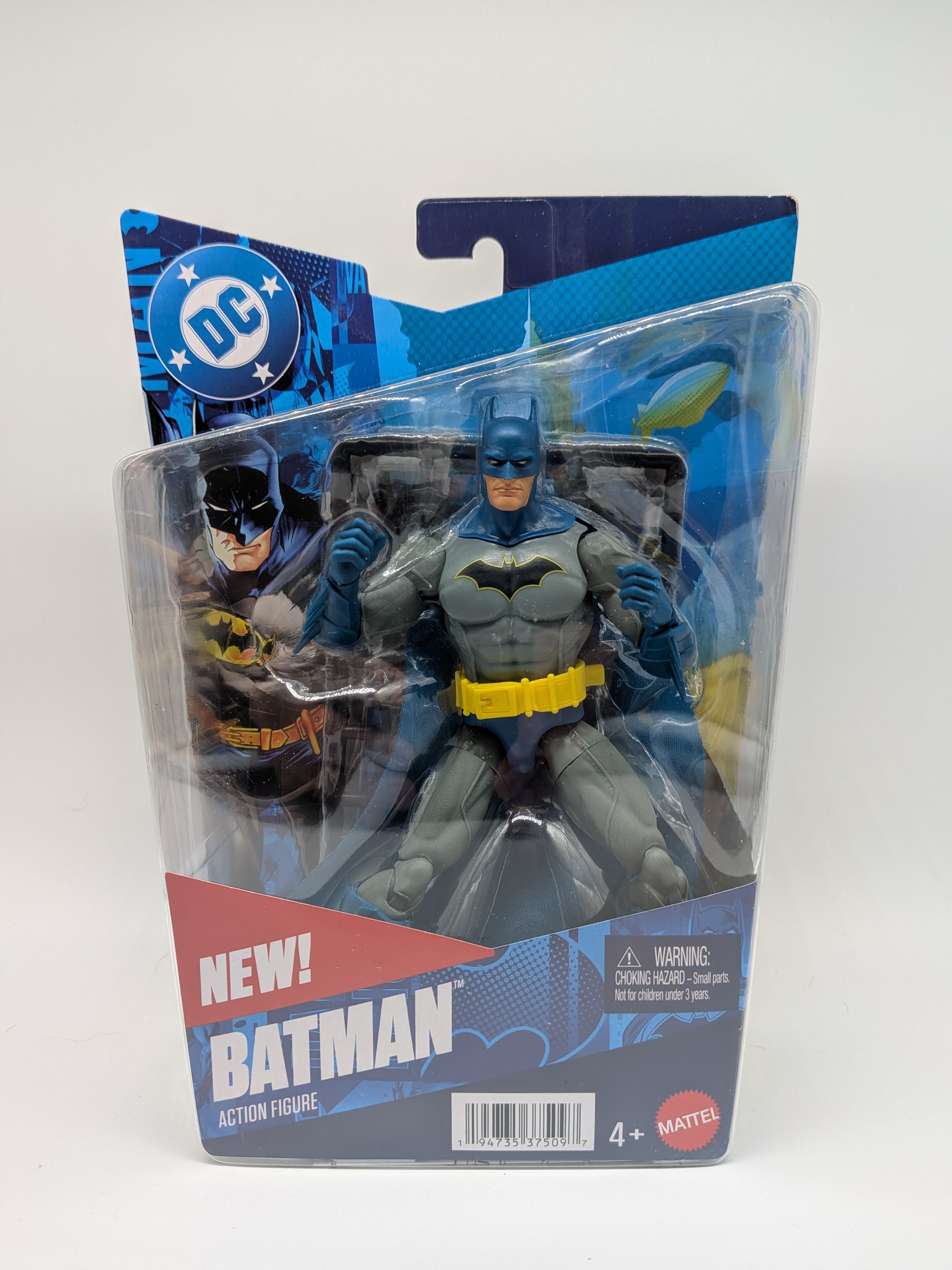 Batman action figure in packaging with DC logo