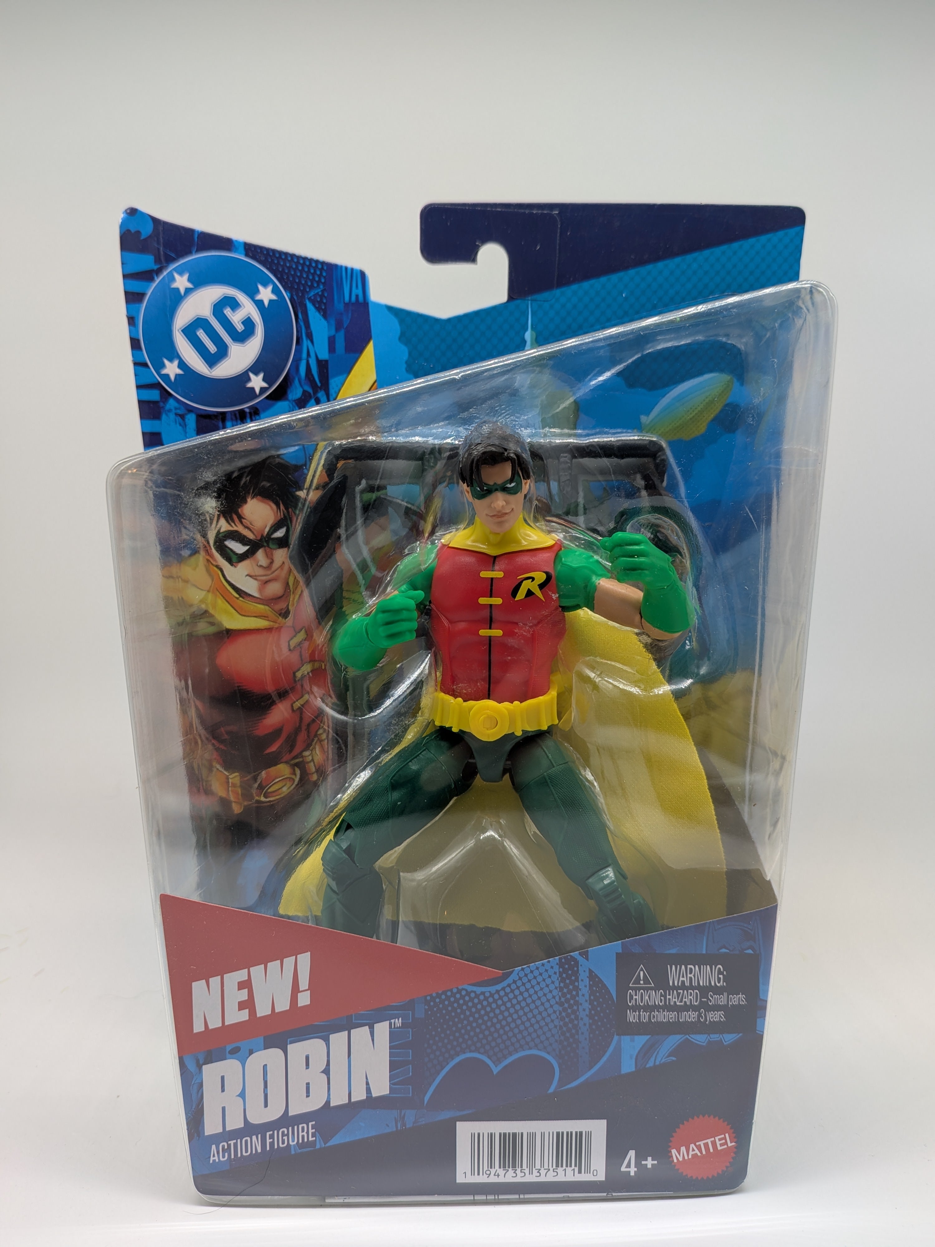 Action figure of Robin in packaging with DC logo