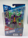 Action figure of The Joker in packaging with DC logo