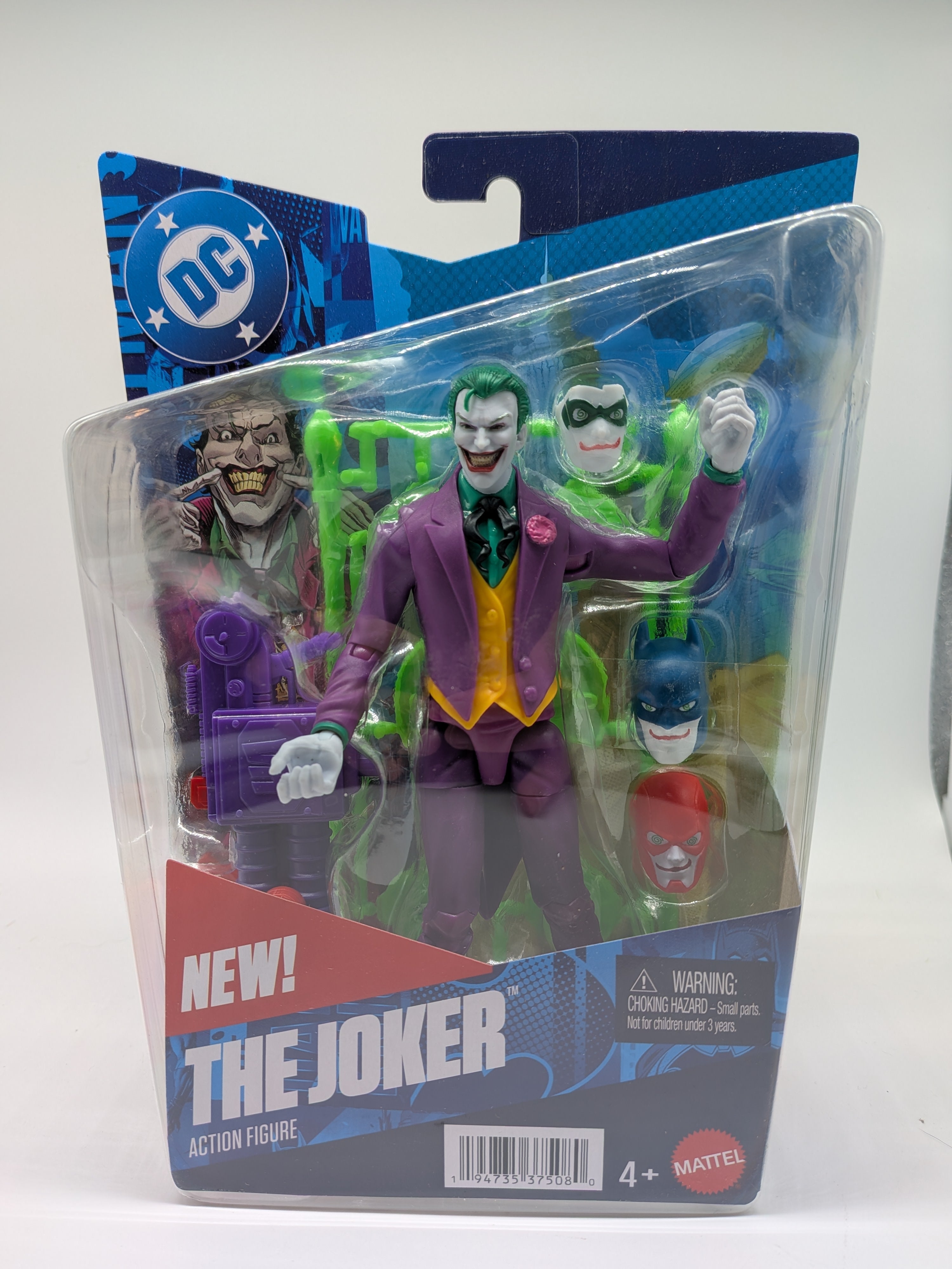 Action figure of The Joker in packaging with DC logo