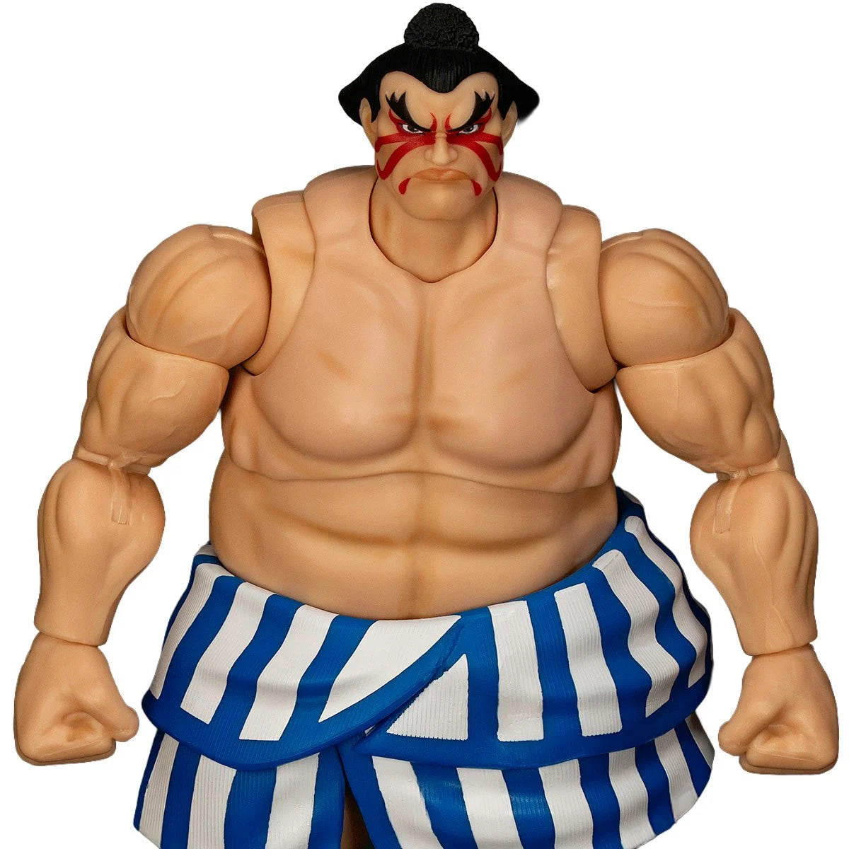 Street Fighter E. Honda with blue and white striped pants on a white background