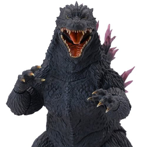  Godzilla action figure with open mouth and raised arms on a white background