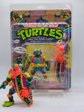 1990 Playmates Teenage Mutant Ninja Turtles TMNT "Mike, the Sewer Surfer" – Mint on Card (MOC), Unpunched